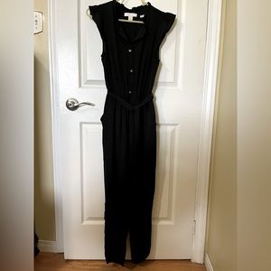 Black jumpsuit size small with ruffle trim.